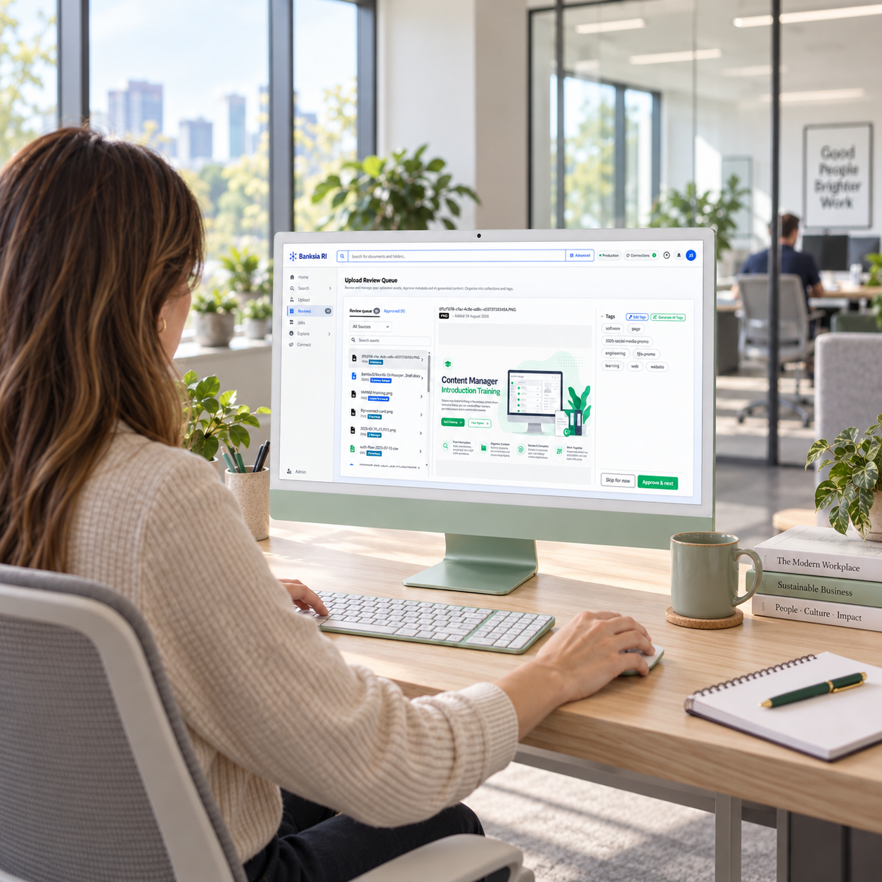 A woman using Banksia RI on an iMac in an office